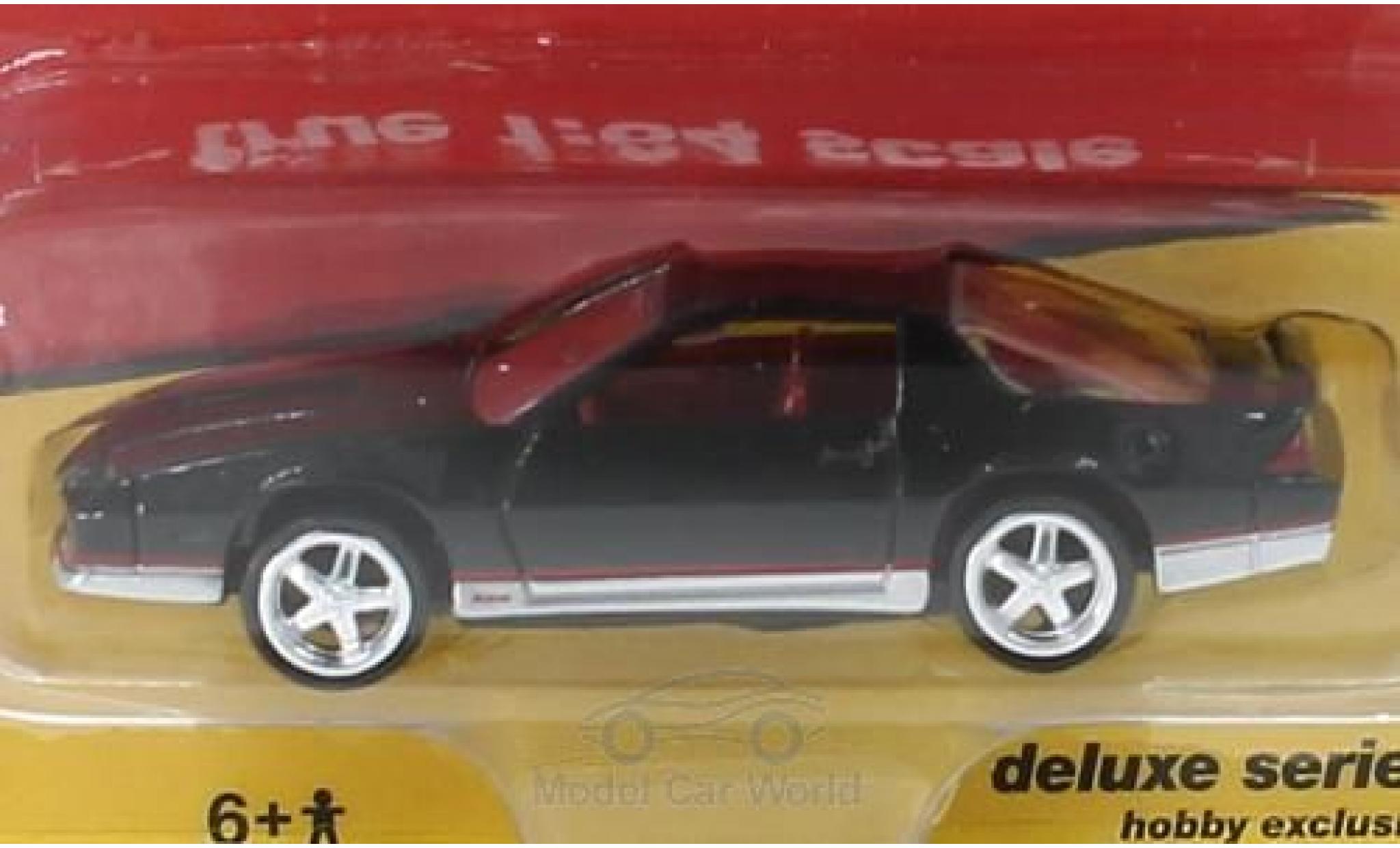Chevrolet Camaro 1/64 Auto World nero 1984 modellino in miniatura
