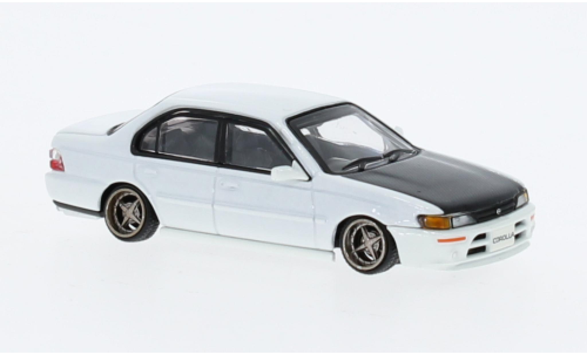 Toyota Corolla 1/64 BM Creations (AE100) bianco 1996 modellino in miniatura