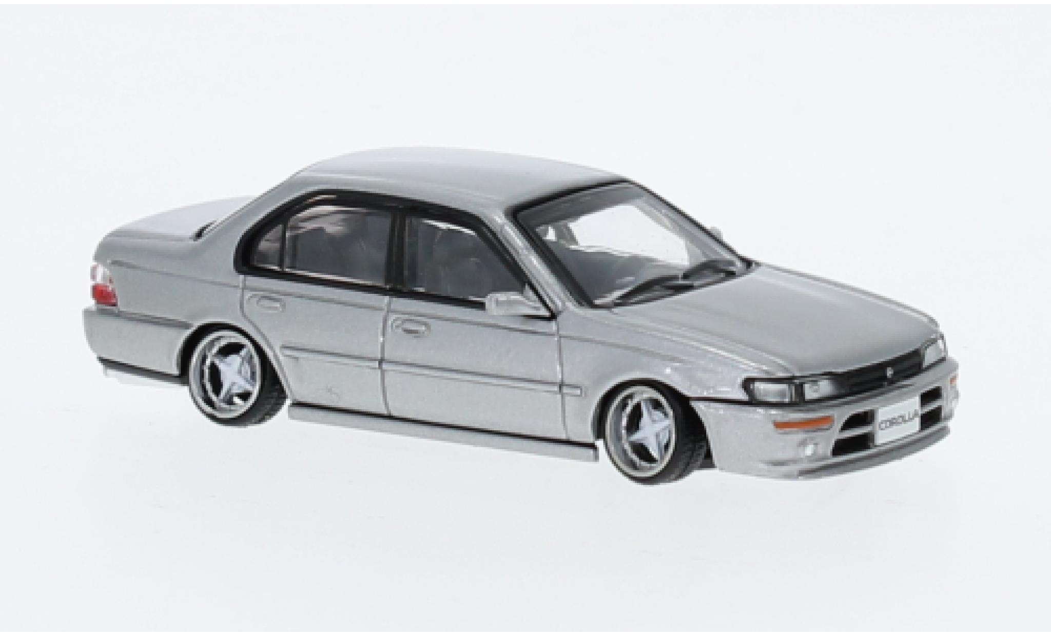 Toyota Corolla 1/64 BM Creations (AE100) metallise grigio 1996 modellino in miniatura