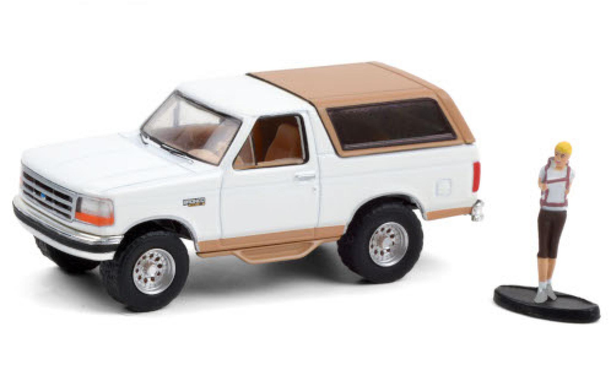 Ford Bronco 1/64 Greenlight Eddie Bauer bianco/matt-beige 1996 avec figurine modellino in miniatura