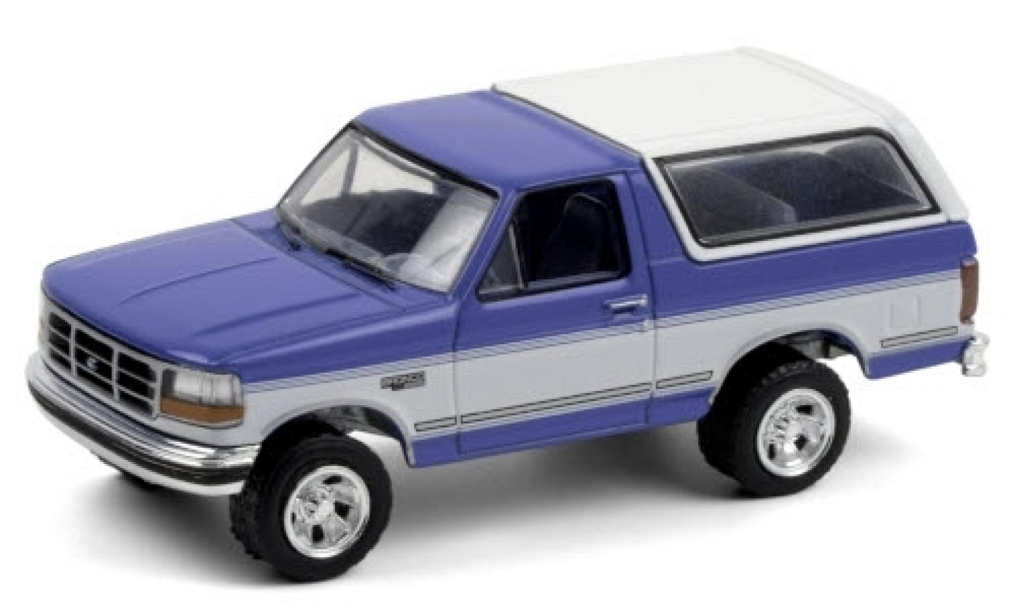Ford Bronco 1/64 Greenlight XLT metallico blu/bianco 1992 modellino in miniatura