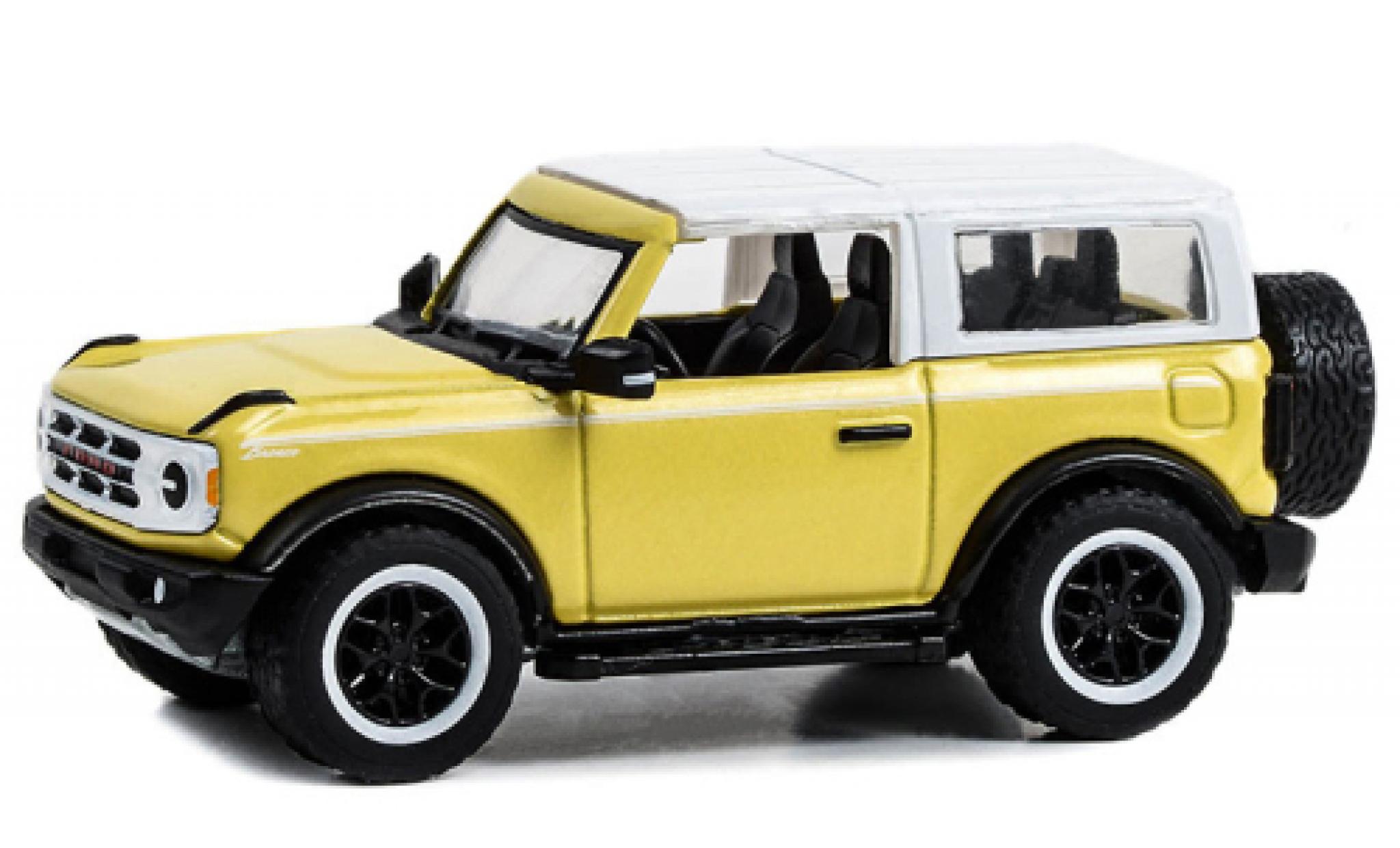 Ford Bronco 1/64 Greenlight Heritage Edition giallo clair/bianco 2023 modellino in miniatura