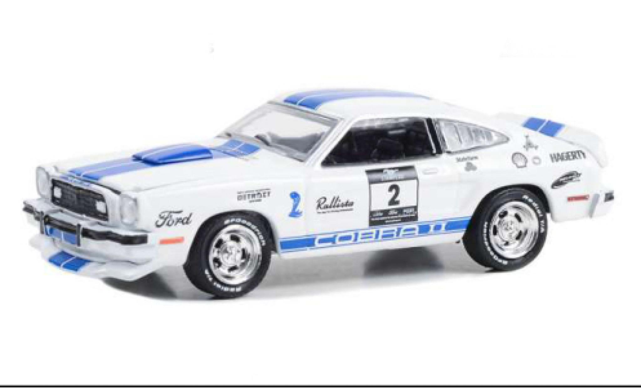 Ford Mustang 1/64 Greenlight II Cobra II bianco/blu 1976 modellino in miniatura