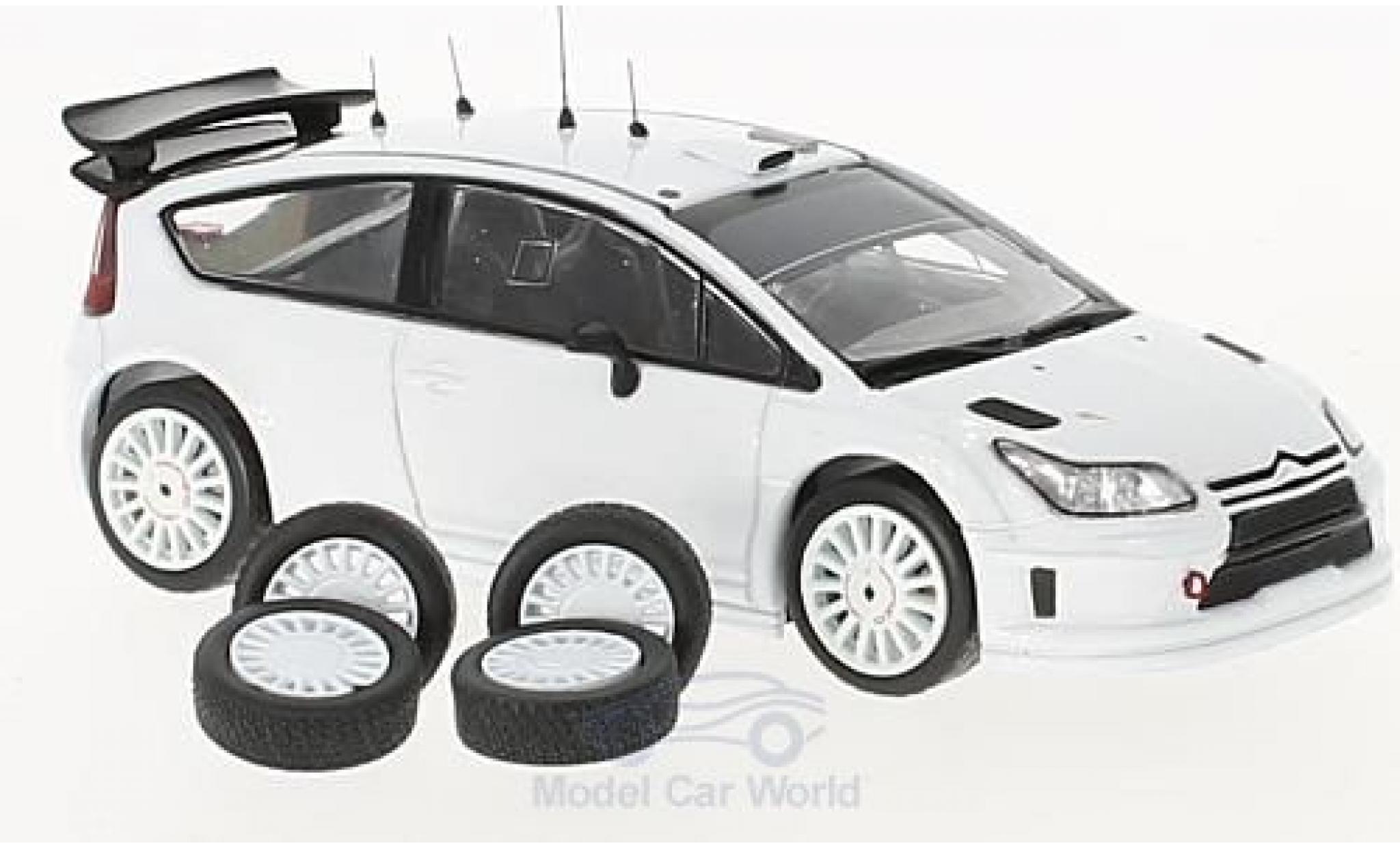 Citroen C4 WRC 1/43 IXO WRC bianco 2010 Plain Body Version inklusive 4 Ersatzräder modellino in miniatura