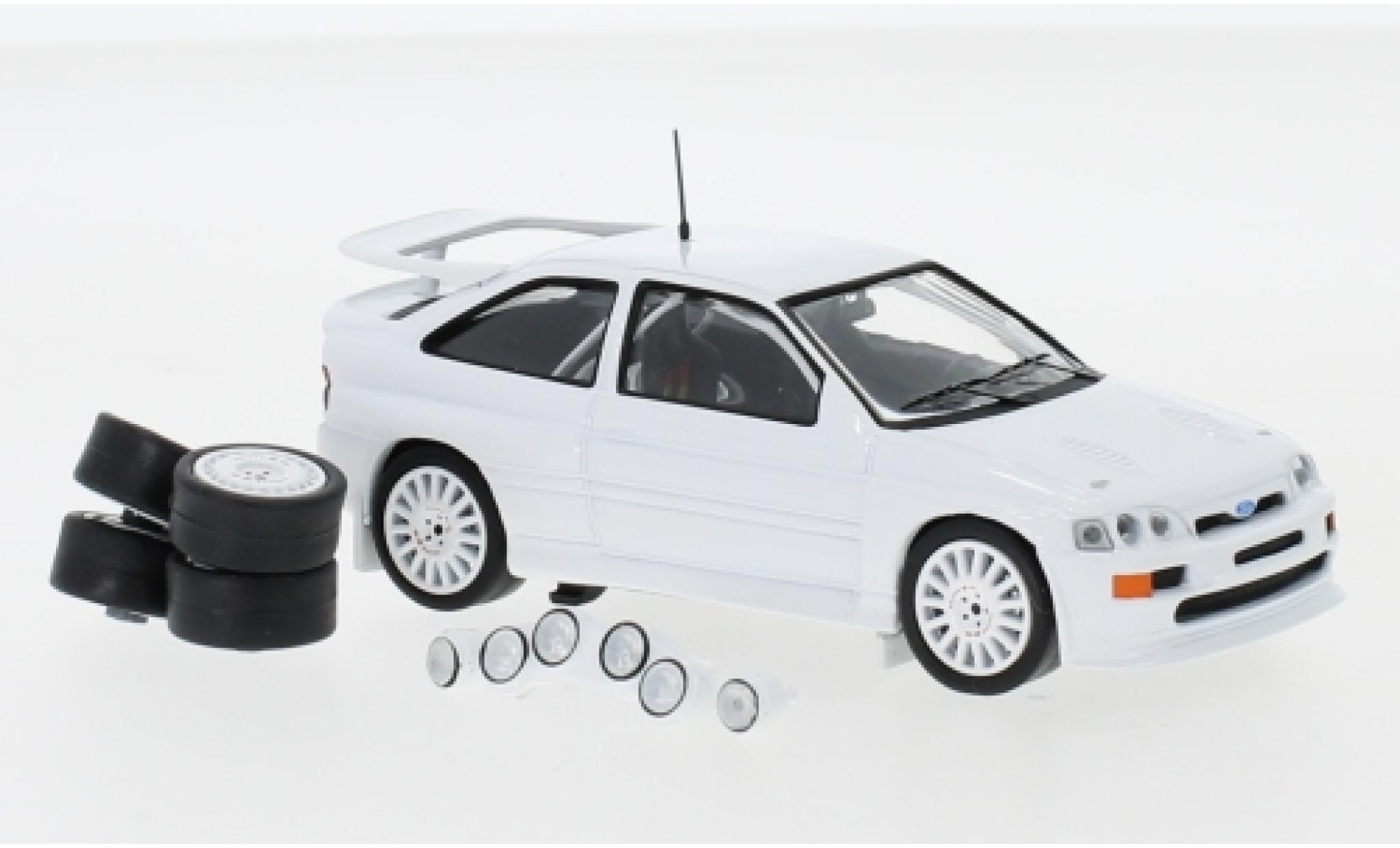 Ford Escort 1/43 IXO RS Cosworth bianco 1994 Plain Body Version y compris les 4 Ersatzräder et extra Scheinwerfer modellino in miniatura