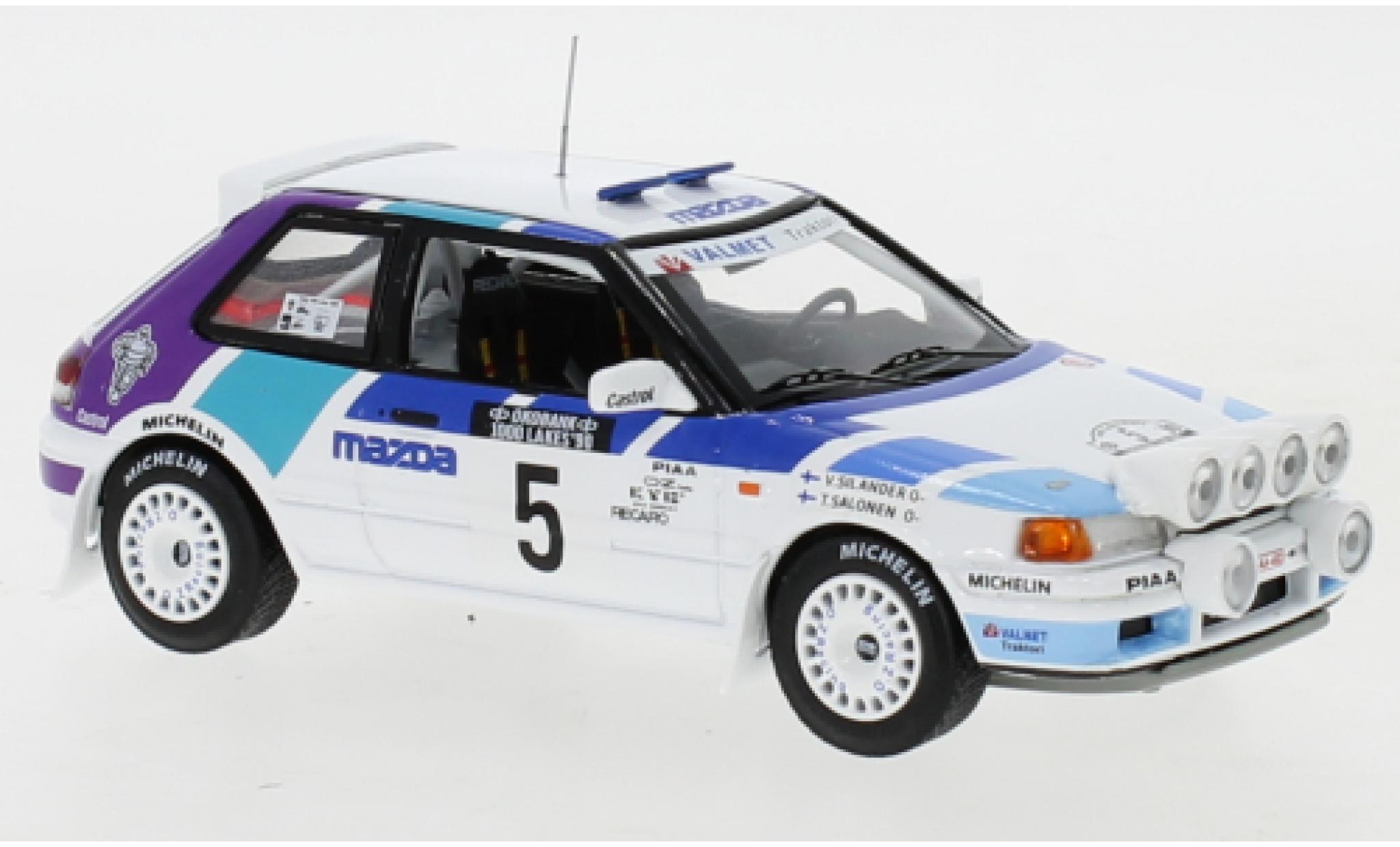 Mazda 323 1/43 IXO GTX No.5 Rally Team Europe 1000 Lakes Rallye 1990 with night lights T.Salonen/V.Silander modellino in miniatura