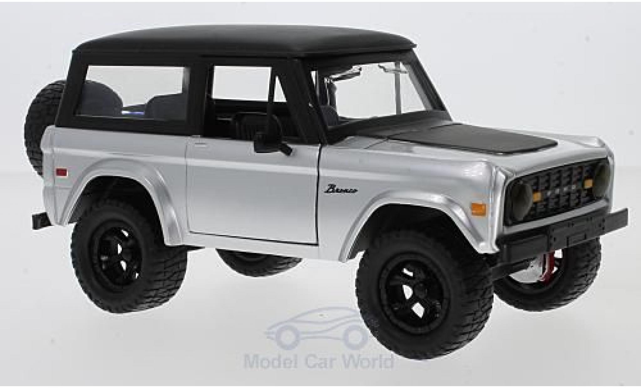 Ford Bronco 1/24 Jada Toys grigio/nero 1973 mit Tuningrädern modellino in miniatura