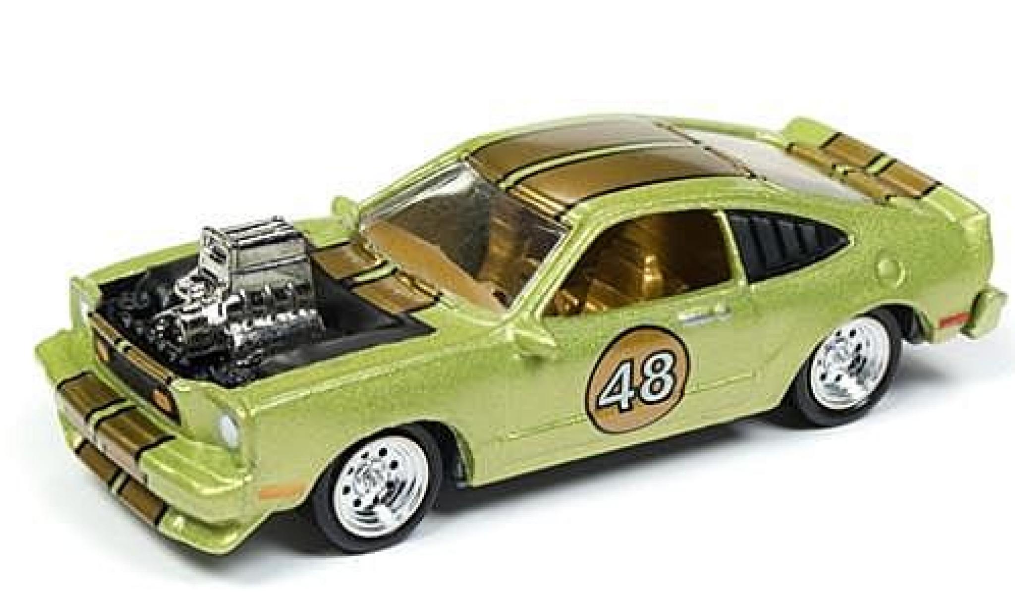 Ford Mustang 1/64 Johnny Lightning II Cobra metallico verde/gold The Spoilers 1976 tuning sans Vitrine modellino in miniatura