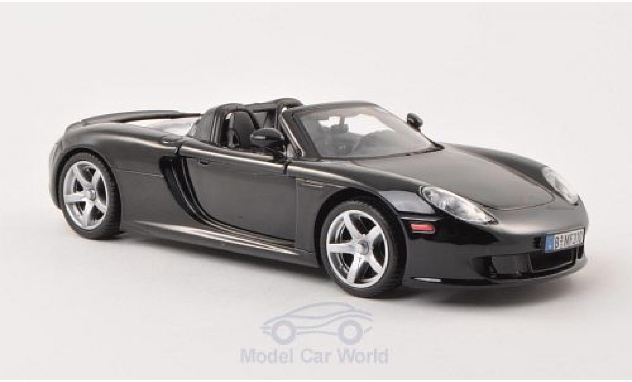 Porsche Carrera GT 1/24 Motormax nero ohne Vitrine modellino in miniatura