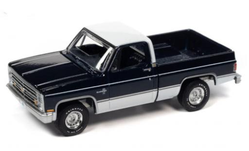 Chevrolet Silverado 1/64 Auto World 10 Fleetside blu foncé/bianco 1985 modellino in miniatura