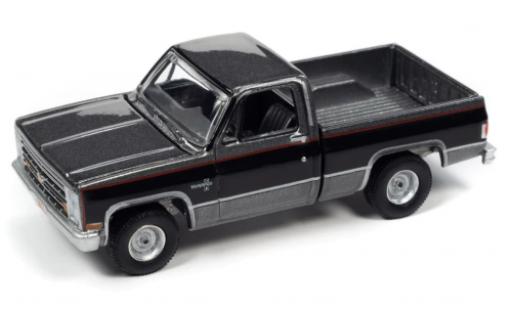 Chevrolet Silverado 1/64 Auto World R10 Fleetside metallise grigio/nero 1987 modellino in miniatura