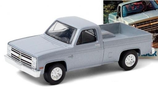 Chevrolet Silverado 1/64 Greenlight metallico grigio 1985 modellino in miniatura