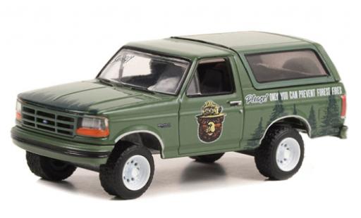 Ford Bronco 1/64 Greenlight verde Smokey Bear 1996 modellino in miniatura